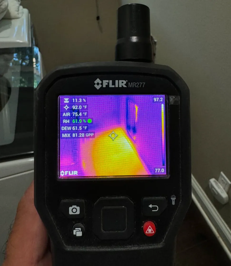 Thermal imaging reading of hidden moisture behind a wall on a Revive Pro Solutions job